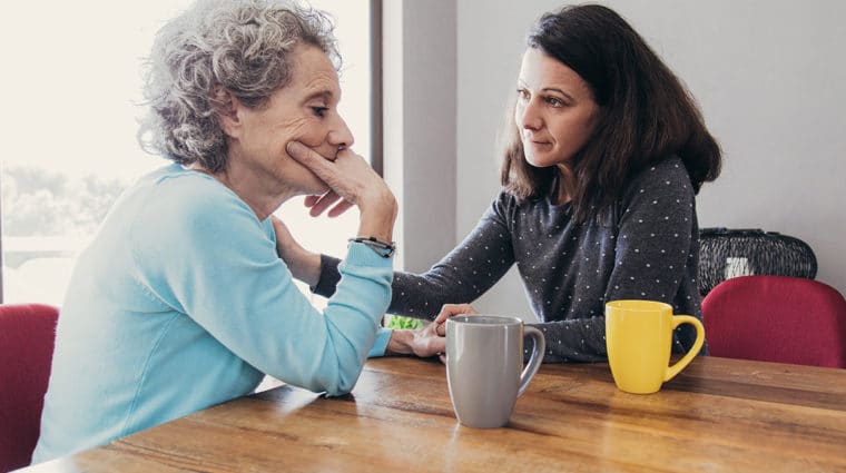 Daughter Having Serious Conversation with Senior Mother