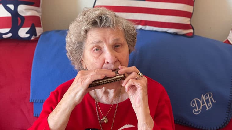 Mildred playing the harmonica
