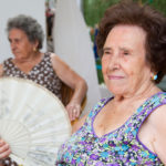 Older women trying to stay cool in hot summer temperatures