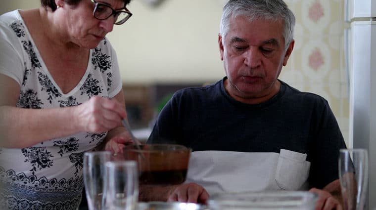 Older couple eats a simple meal at home together