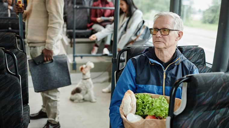 Senior Man Sitting in Bus