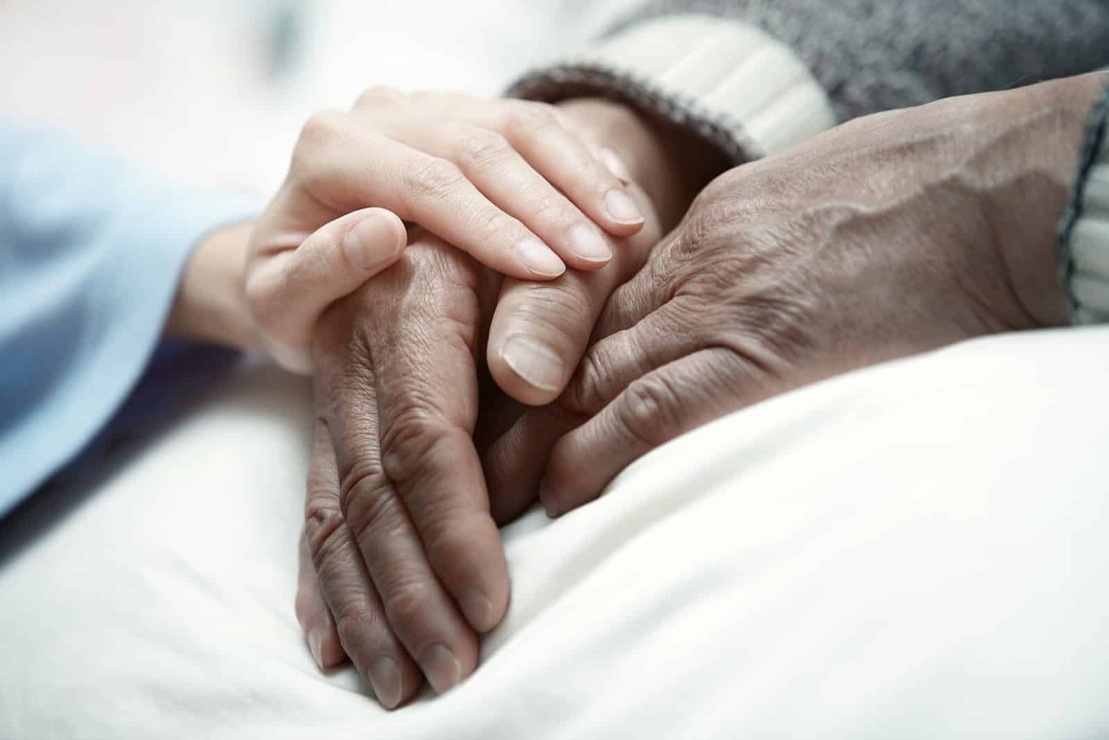 Caring Hands Holding a Patient's Hands