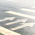 Image of arrows painted on street