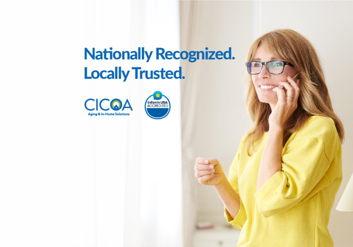 Smiling woman in a yellow blouse talks on a mobile phone, with CICOA and accreditation logos to her left.