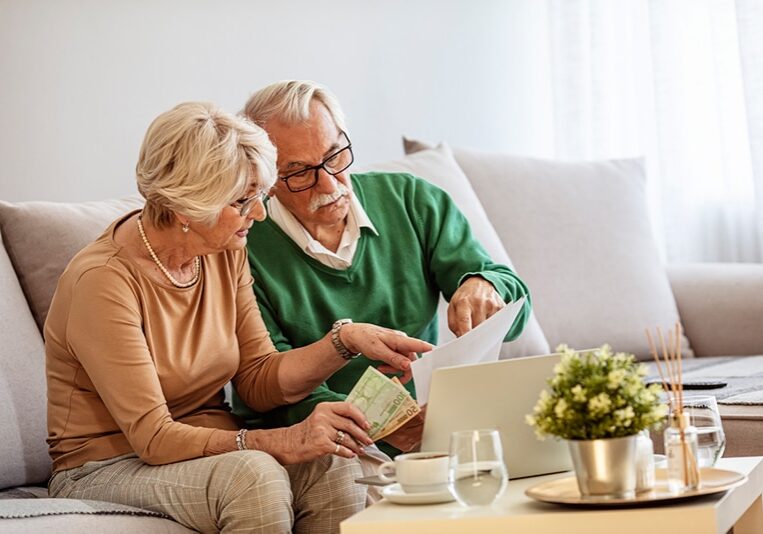 Older couple working on taxes together