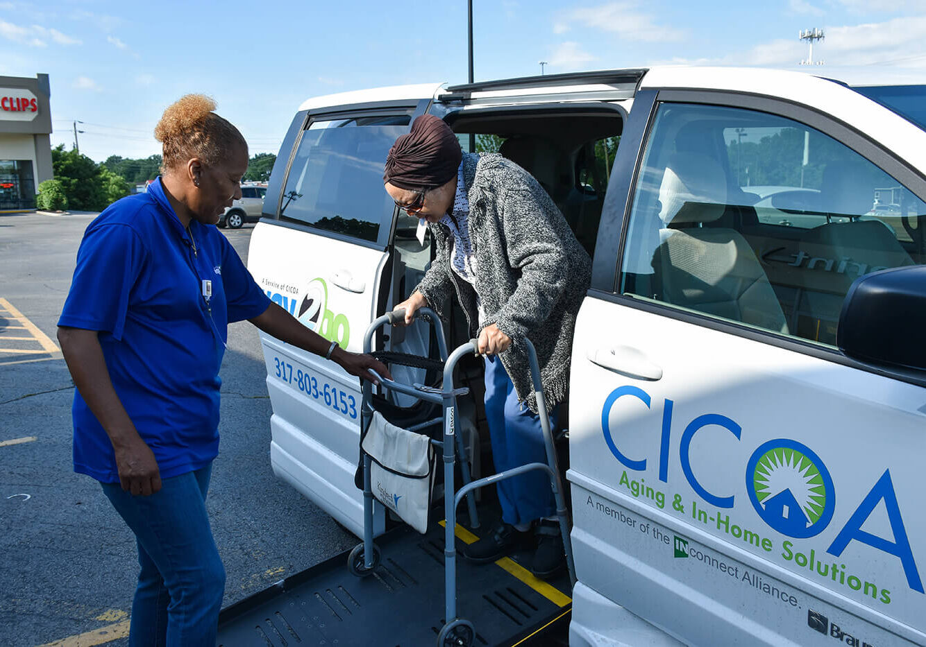 Older woman getting out of a CICOA Way2Go Transportation Van